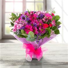 A deep pink and purple Seasonal Bouquet